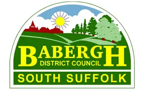 Babergh District Council logo featuring a rural landscape with trees, a sun, and a church, labeled "South Suffolk."