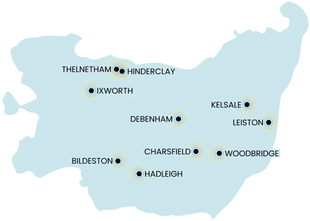 Map of Suffolk highlighting towns with community energy initiatives, including Thelnetham, Hinderclay, Ixworth, Debenham, Bildeston, Hadleigh, Charsfield, Kelsale, Leiston, and Woodbridge.